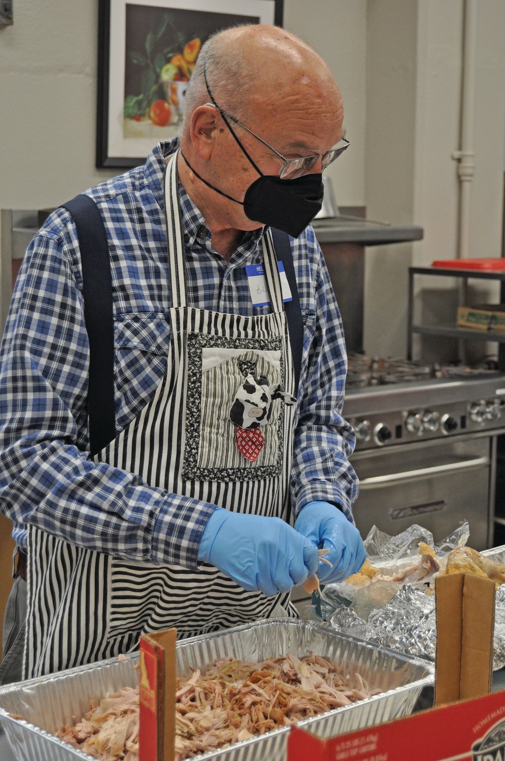 Bill Doemel prepares a turkey Wednesday during preparations for the Community Thanksgiving Dinner at First United Methodist Church.